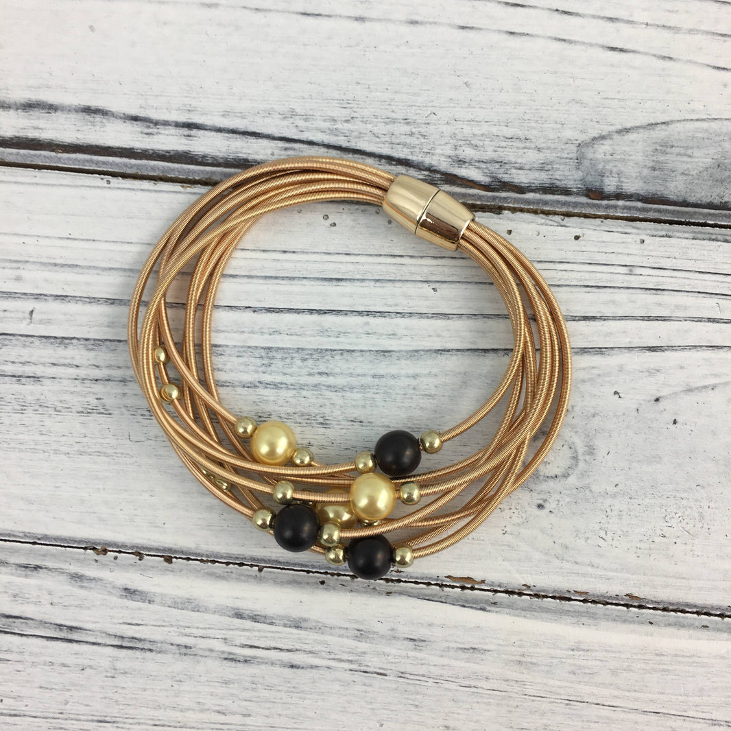 Black and gold pearl guitar string bracelet